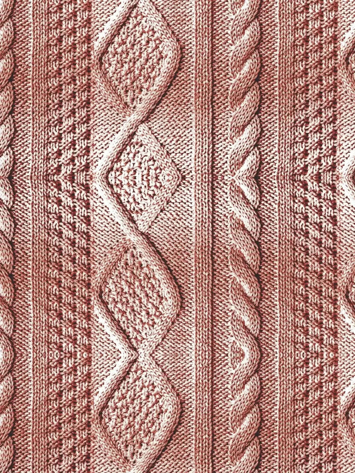 Pink textured knit fabric with rose cable pattern and diamond motifs.