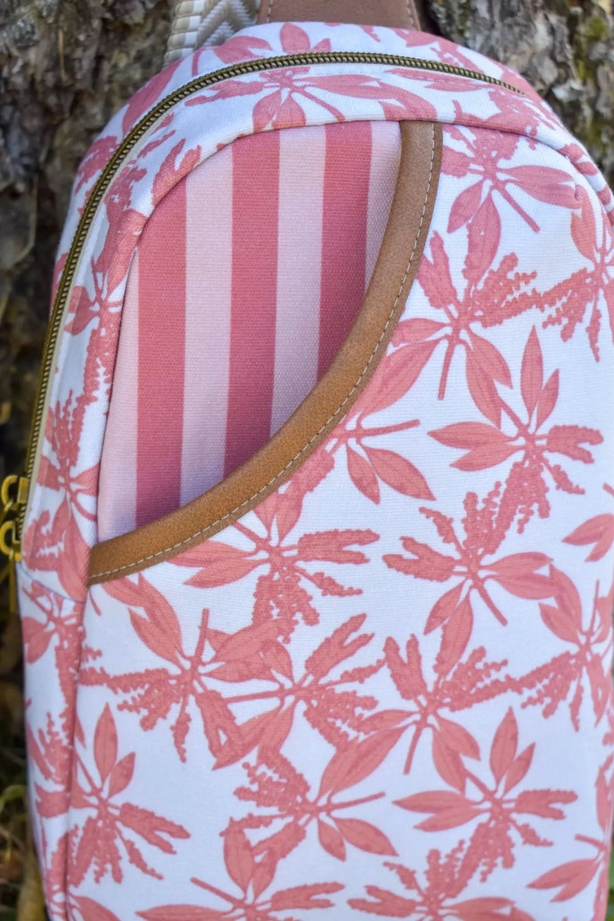 Pink leaves print fabric with autumn floral pattern on white background.