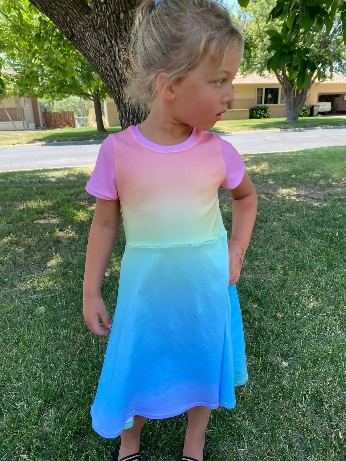 Unicorn ombre fabric with rainbow gradient print in vibrant colors.