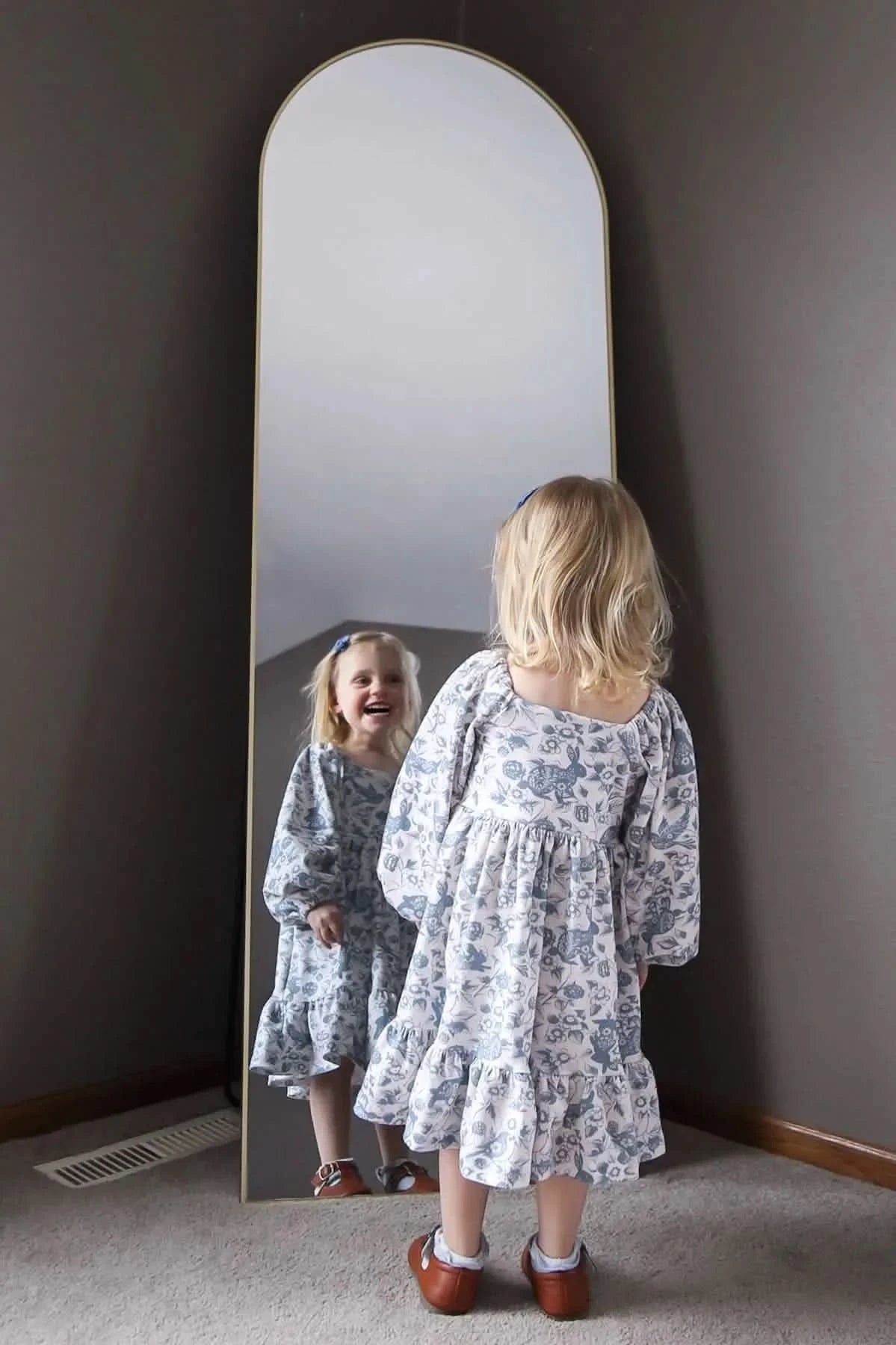 Blue floral bunny bramble fabric with child in dress, sold by the yard.