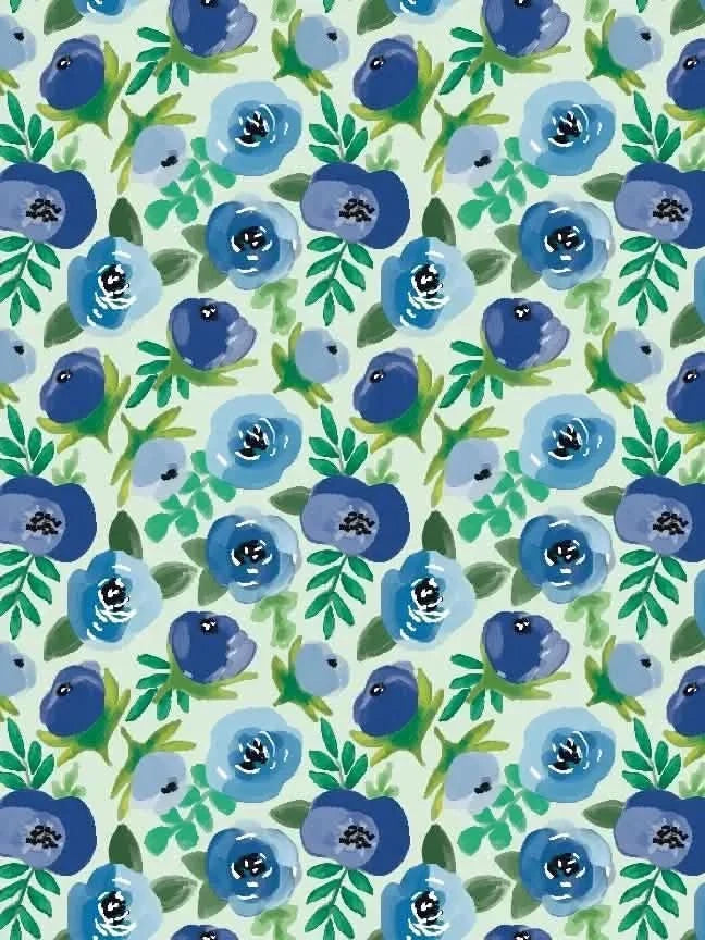 Blue buttercups floral fabric with green leaves on a light green background.