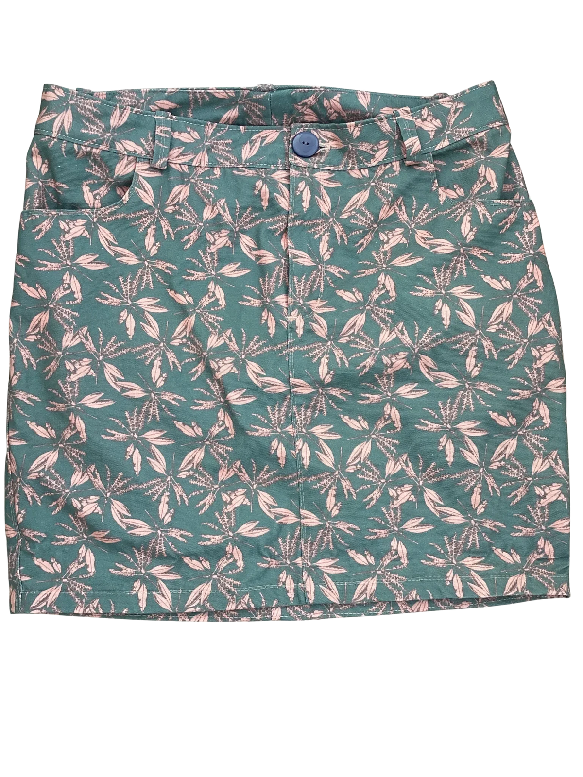 Blush hollow floral print fabric with green and pink leaf-like patterns.