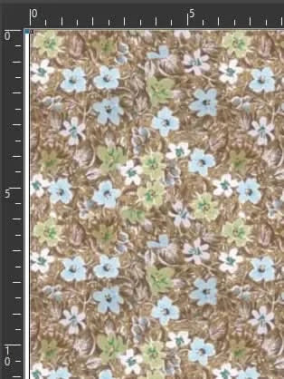 Brown botanical print fabric with leaves and blue flowers on a textured background.