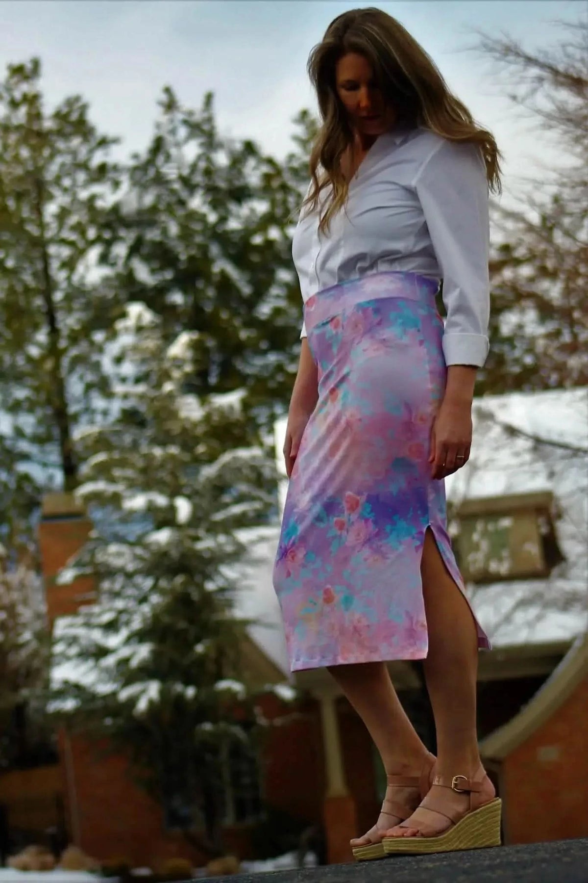 Purple glass flowers fabric with watercolor-like print on a white blouse and skirt.
