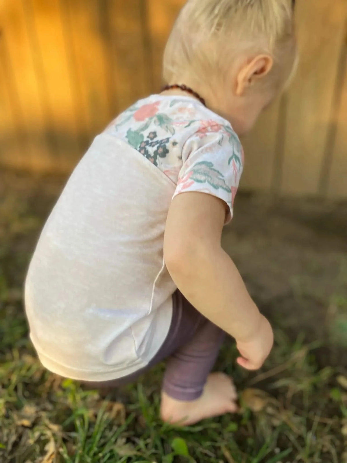 Cream heather fabric with blush floral coordinate print in soft pink and green tones.