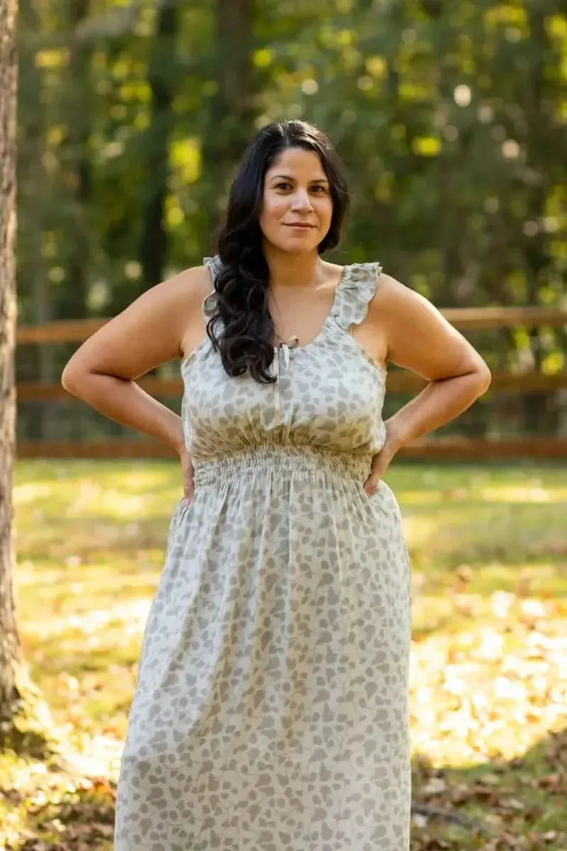 Green leaf print fabric with nature-inspired design in soft green tones.