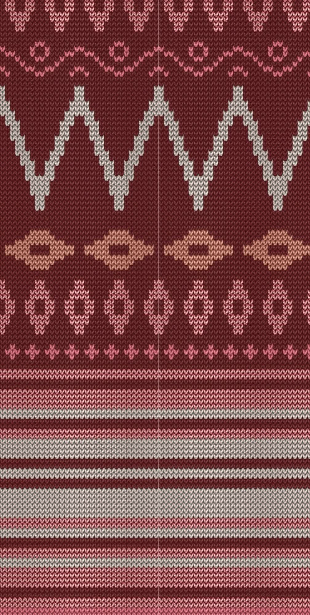 Knitted fabric with red, pink, and beige geometric patterns.