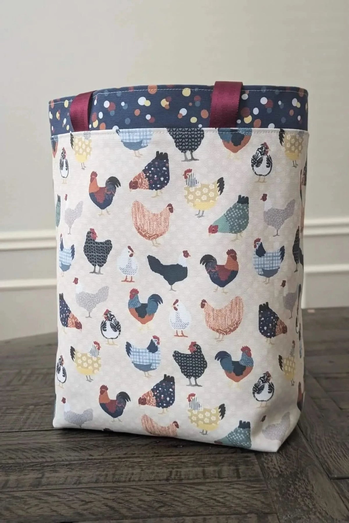 Patchwork print fabric featuring colorful chickens on a light background.