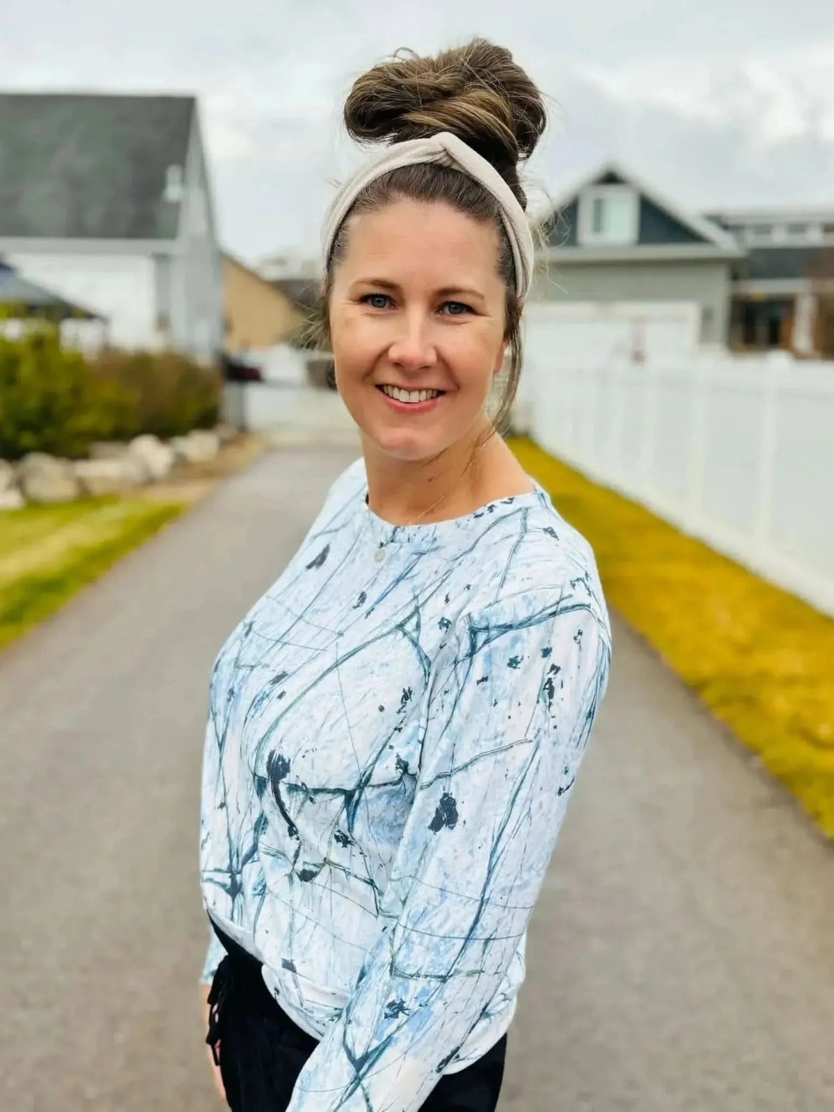 White cracked ice abstract print fabric with gray veining on a light background.