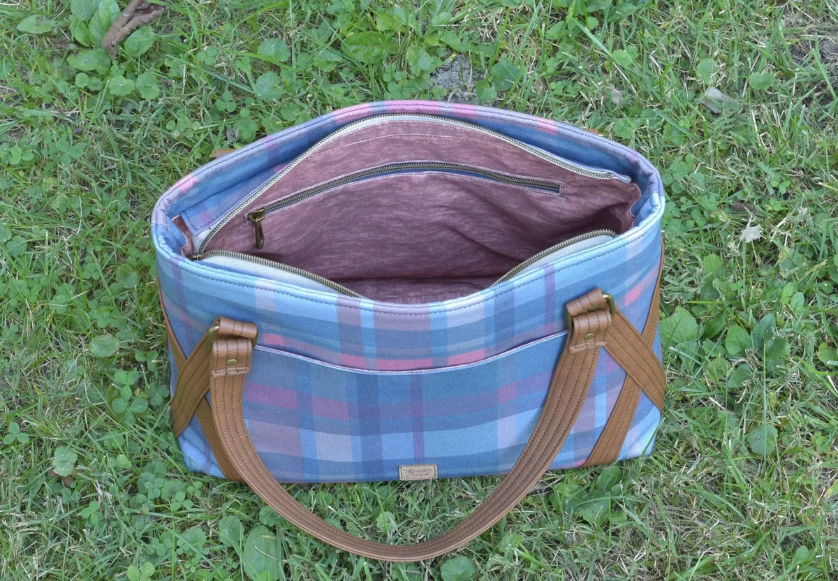 Fall teal plaid fabric print with blue, pink, and white checkered pattern.