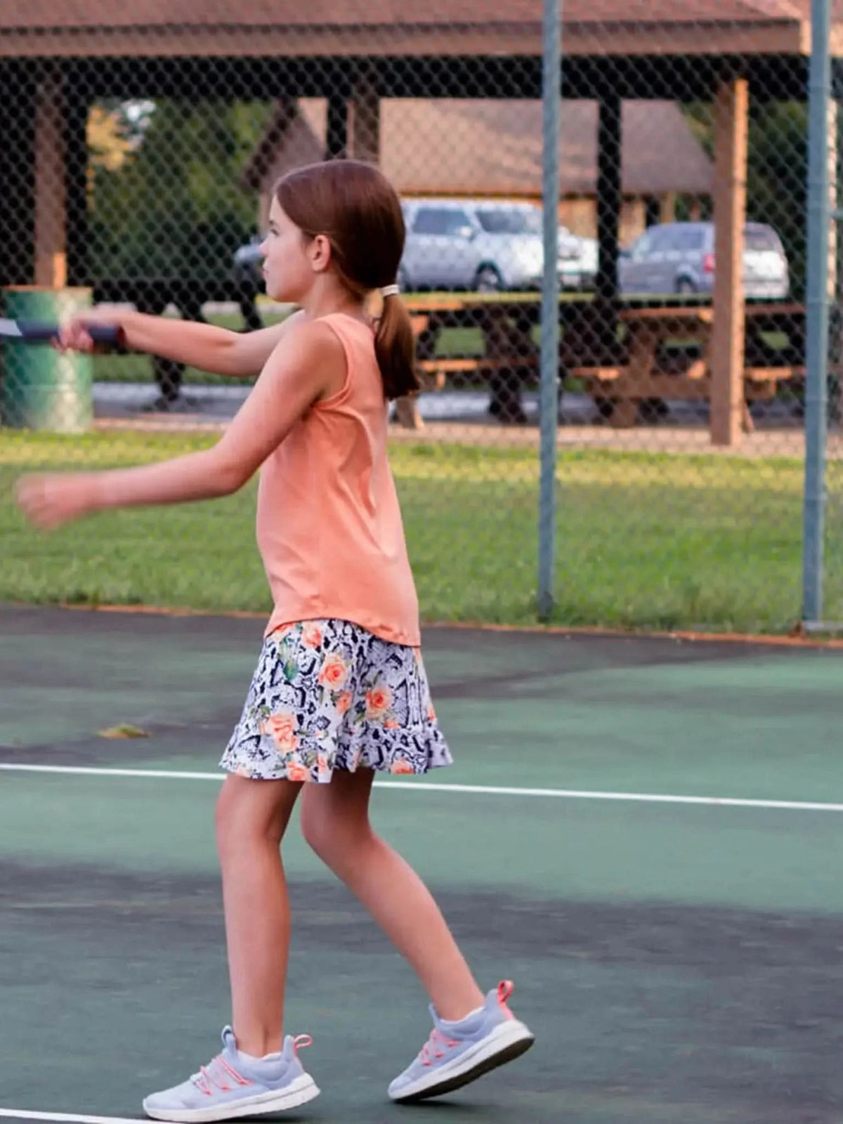 Floral snake print fabric with vibrant patterns on a stretchy cotton lycra base.