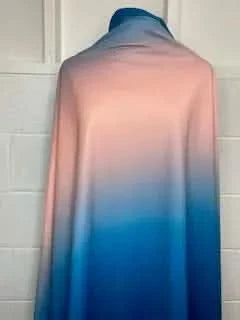 Shoreline ombre fabric transitions from light pink to deep blue.