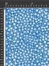 Blue floral fabric with white daisy-like flowers on a light blue background.