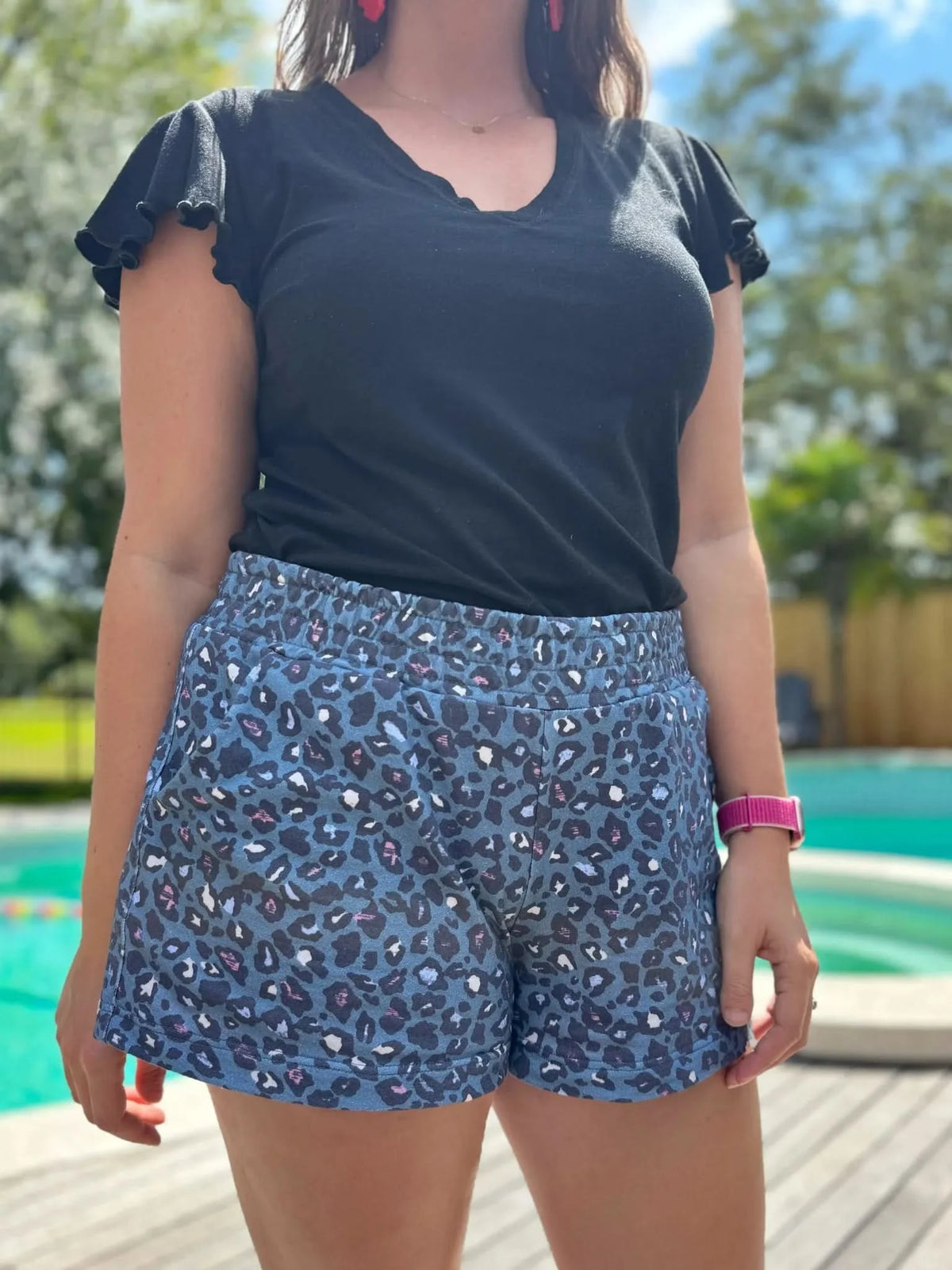 Teal leopard print fabric with animal pattern on various stretch and non-stretch bases.