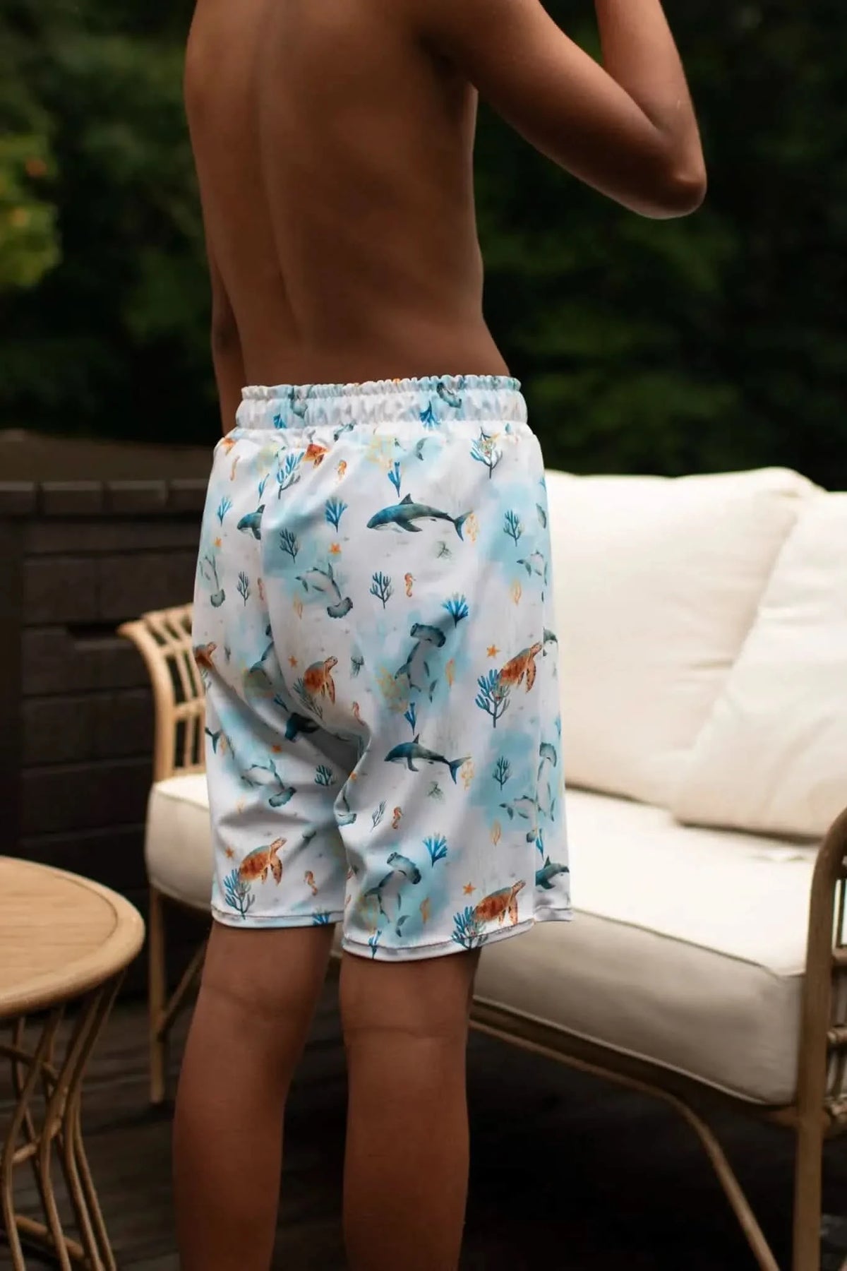 Blue aquatic print fabric with underwater sea creatures and fish motifs.