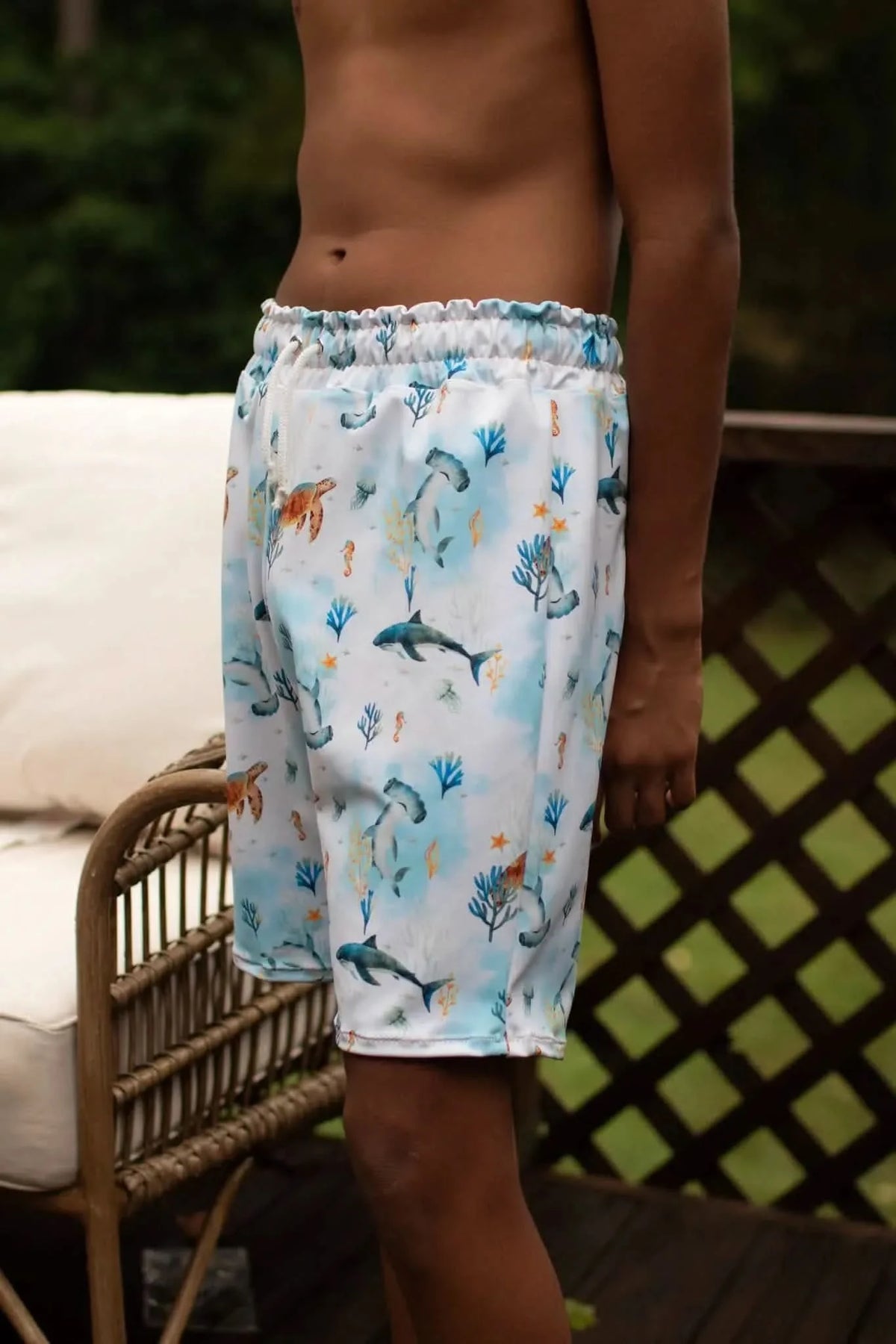 Blue aquatic print fabric with sharks and sea motifs from WayMaker Fabrics.