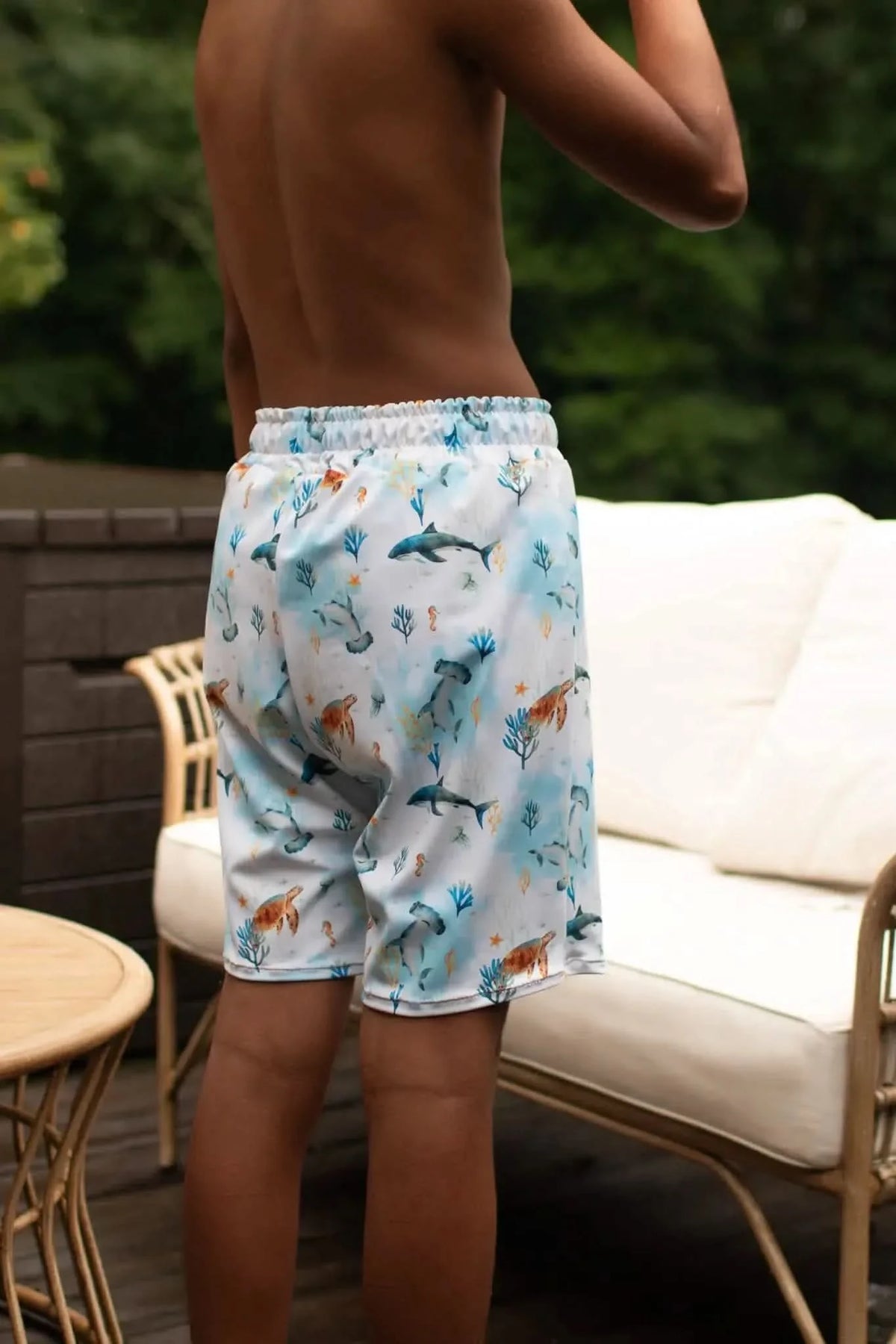 Blue aquatic print fabric with under-the-sea theme featuring sharks and sea motifs.