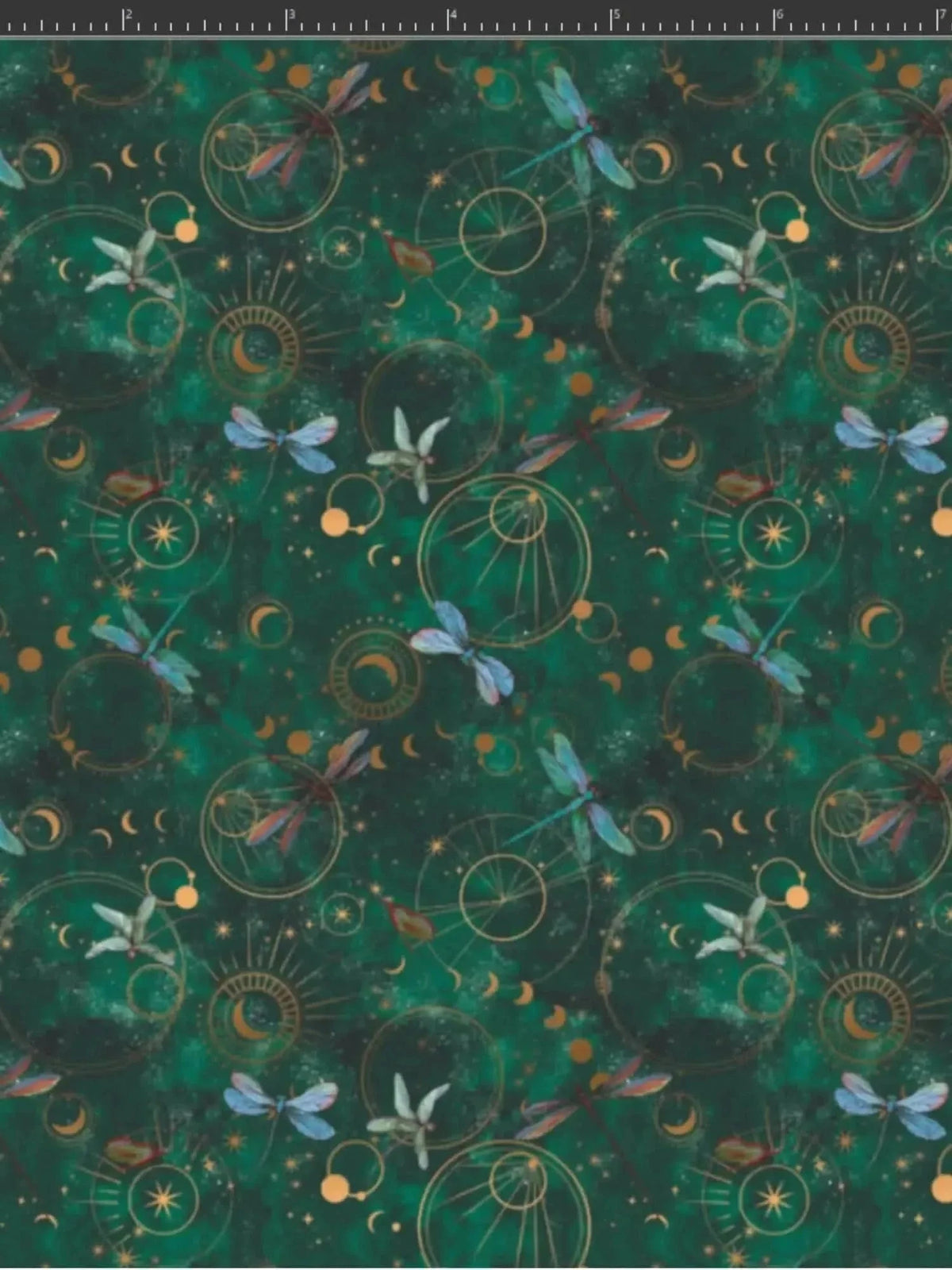 Green fabric with celestial dragonflies, moons, suns, and lilies in a fantasy print.