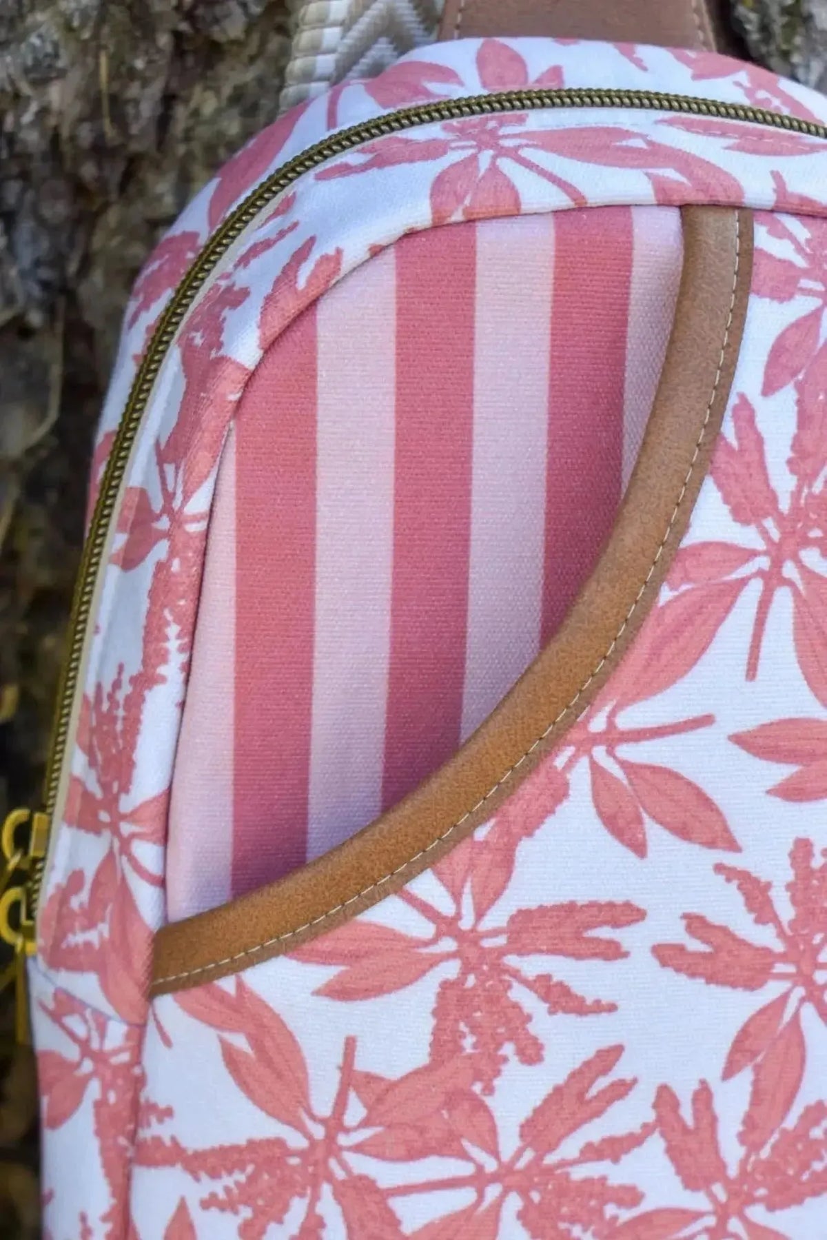 Earthen Path striped fabric in neutral warm tones with palm leaf motifs.