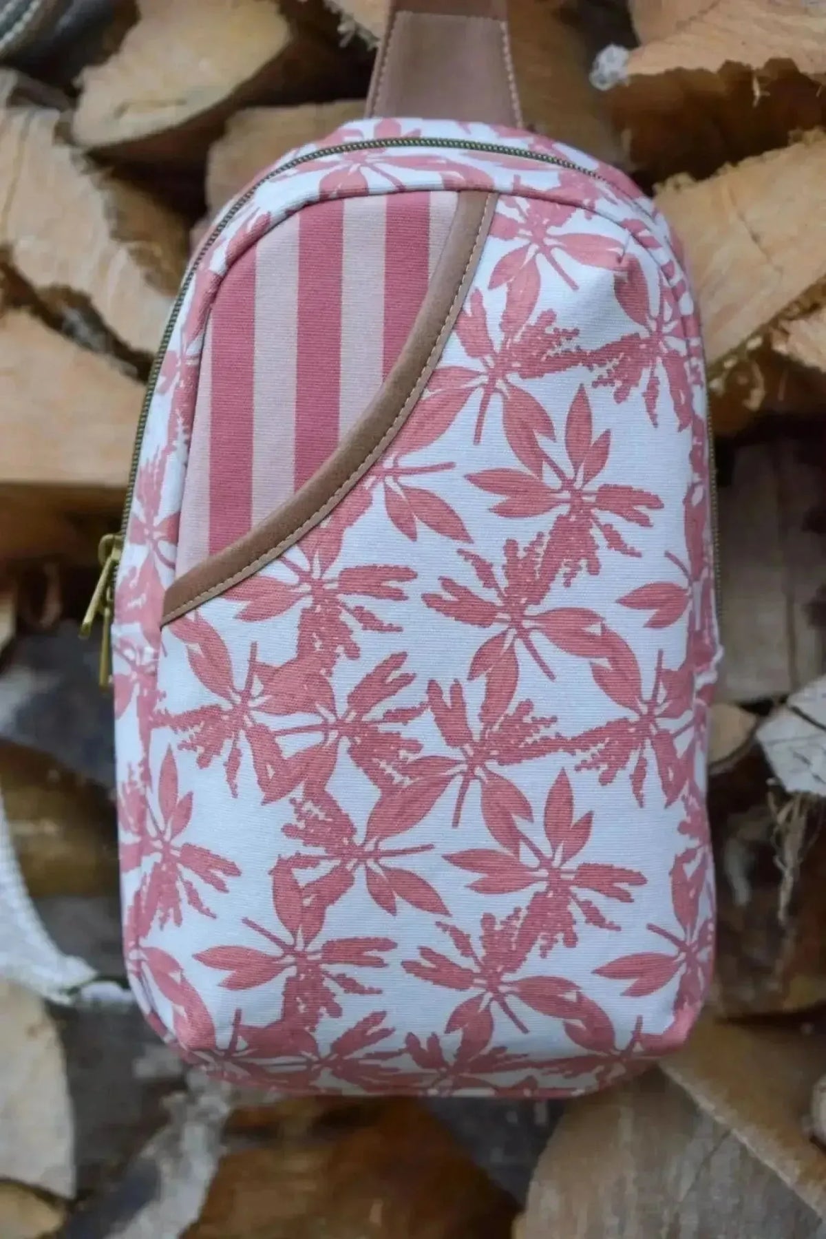 Pink leaves print fabric with autumn floral pattern on white background.