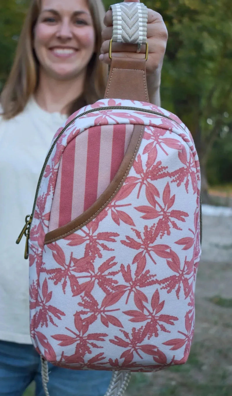 Pink leaves print fabric with autumn floral pattern on white background.