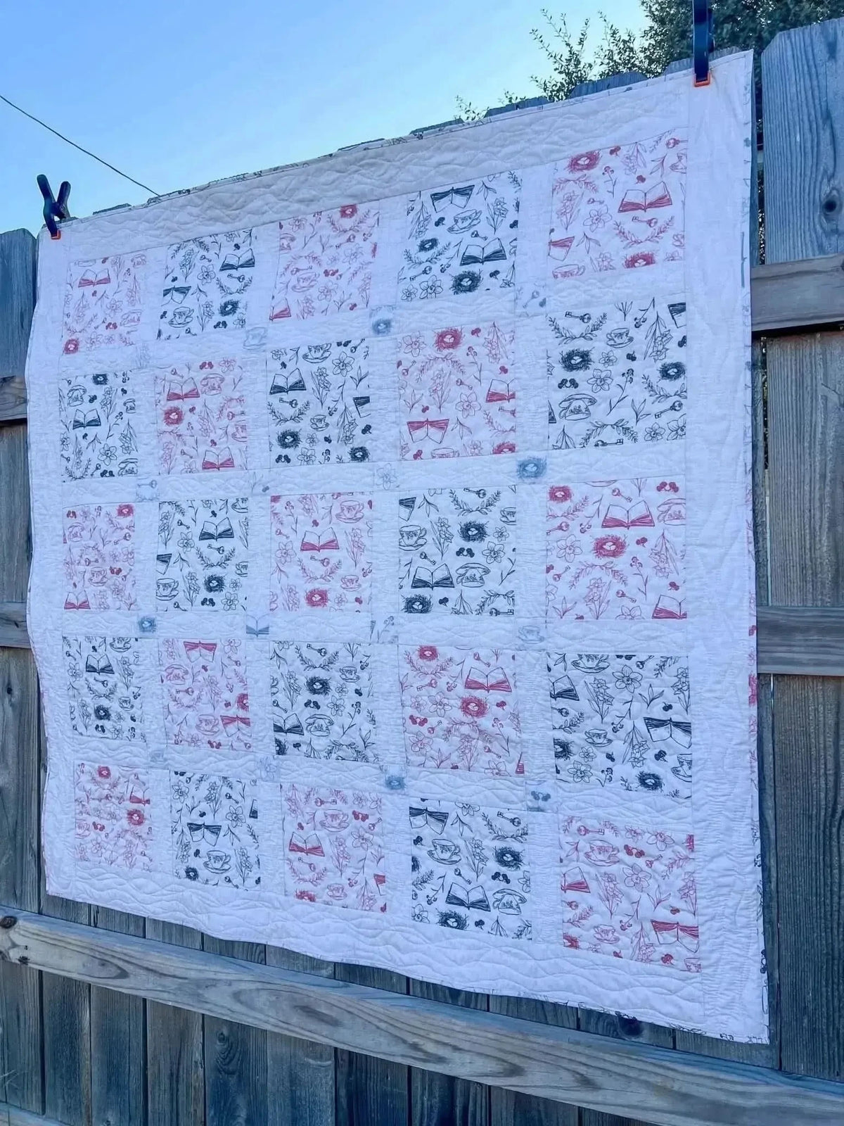 Red tea and toile faith-based print fabric with white background and black accents.