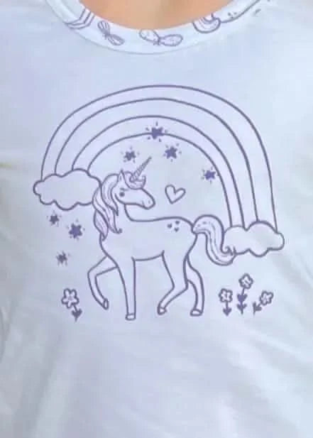 A white fabric panel features a purple outline of a unicorn, rainbow, clouds, and stars.