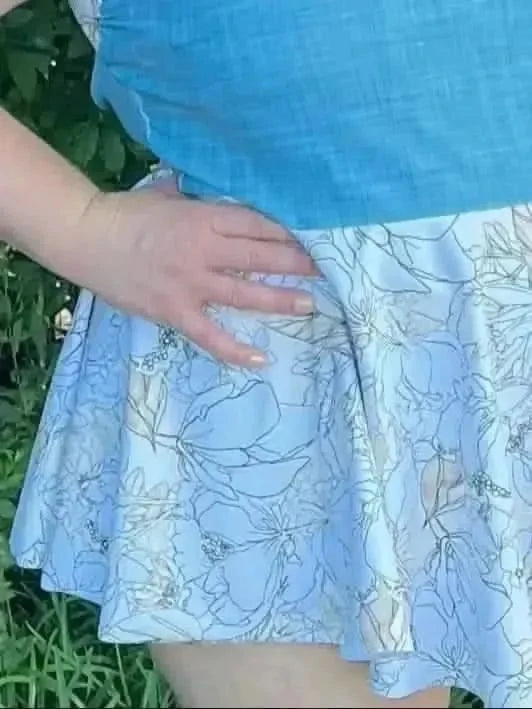 Light blue fabric with white line-drawn floral botanical sketches.