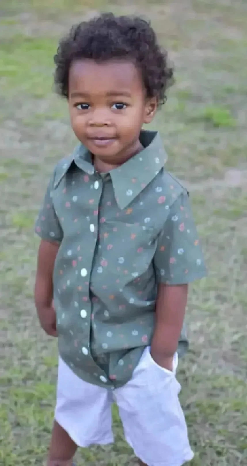Olive ditsy floral fabric with bitty blooms pattern on a green base.