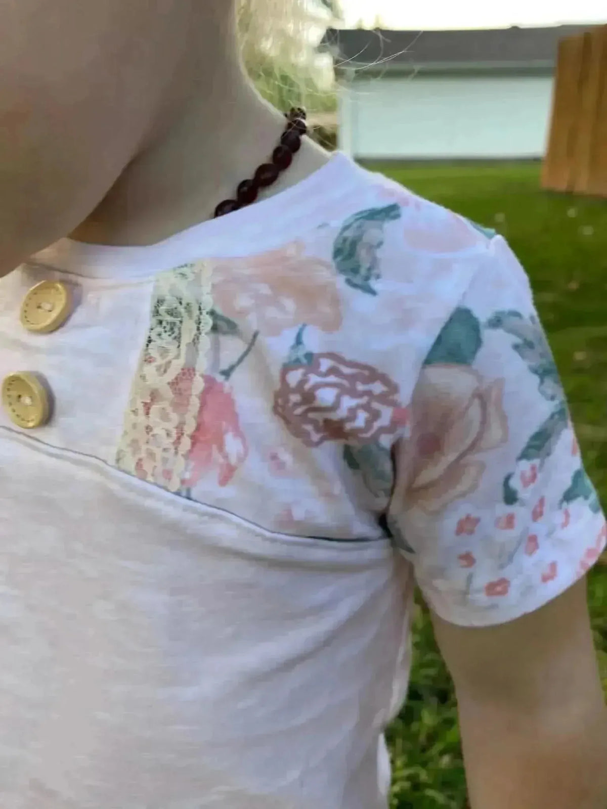 Blush flowers floral print fabric with pink roses and green leaves on white base.