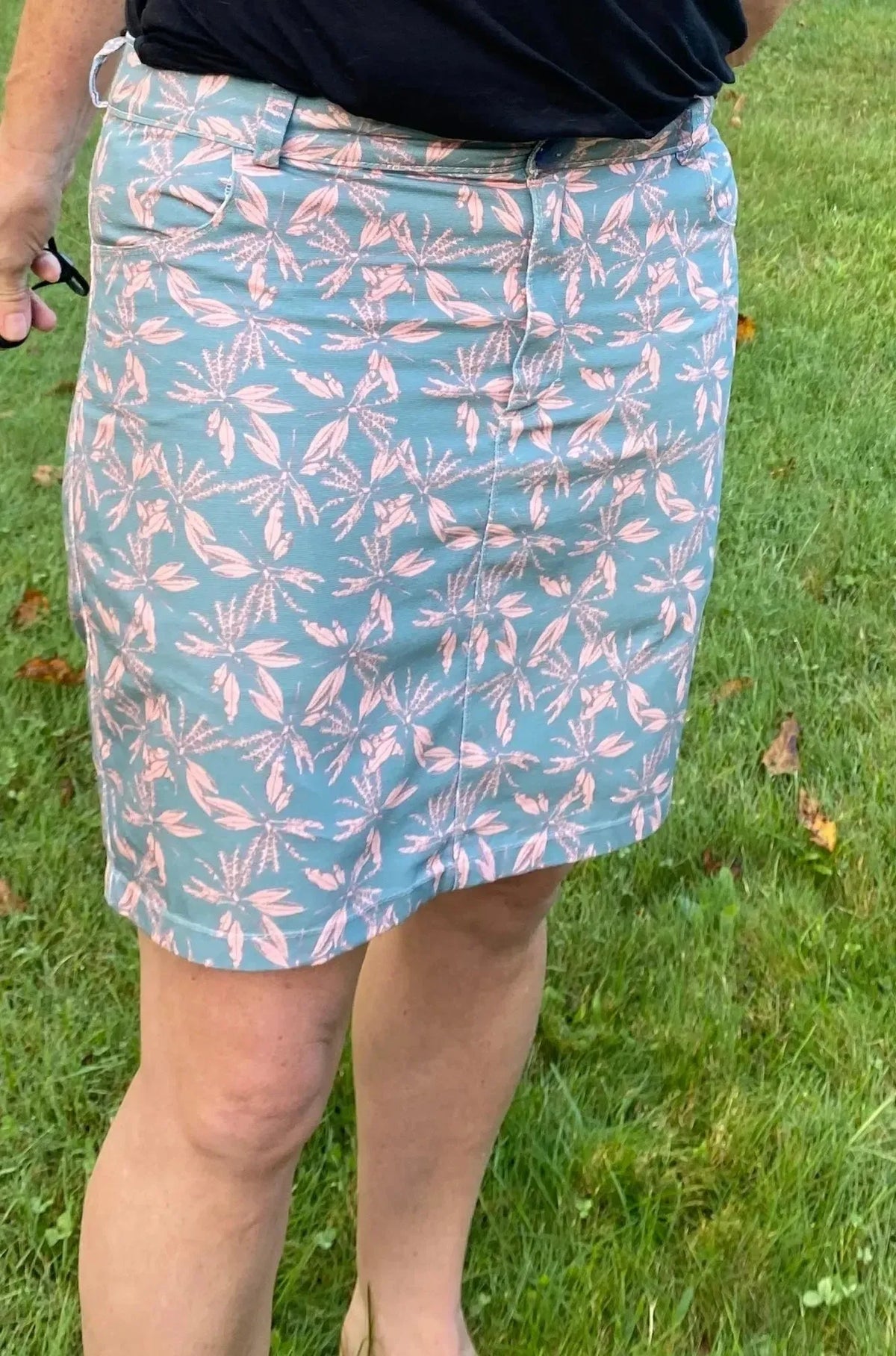 Blush hollow floral print fabric with light blue and pink leaf motifs.