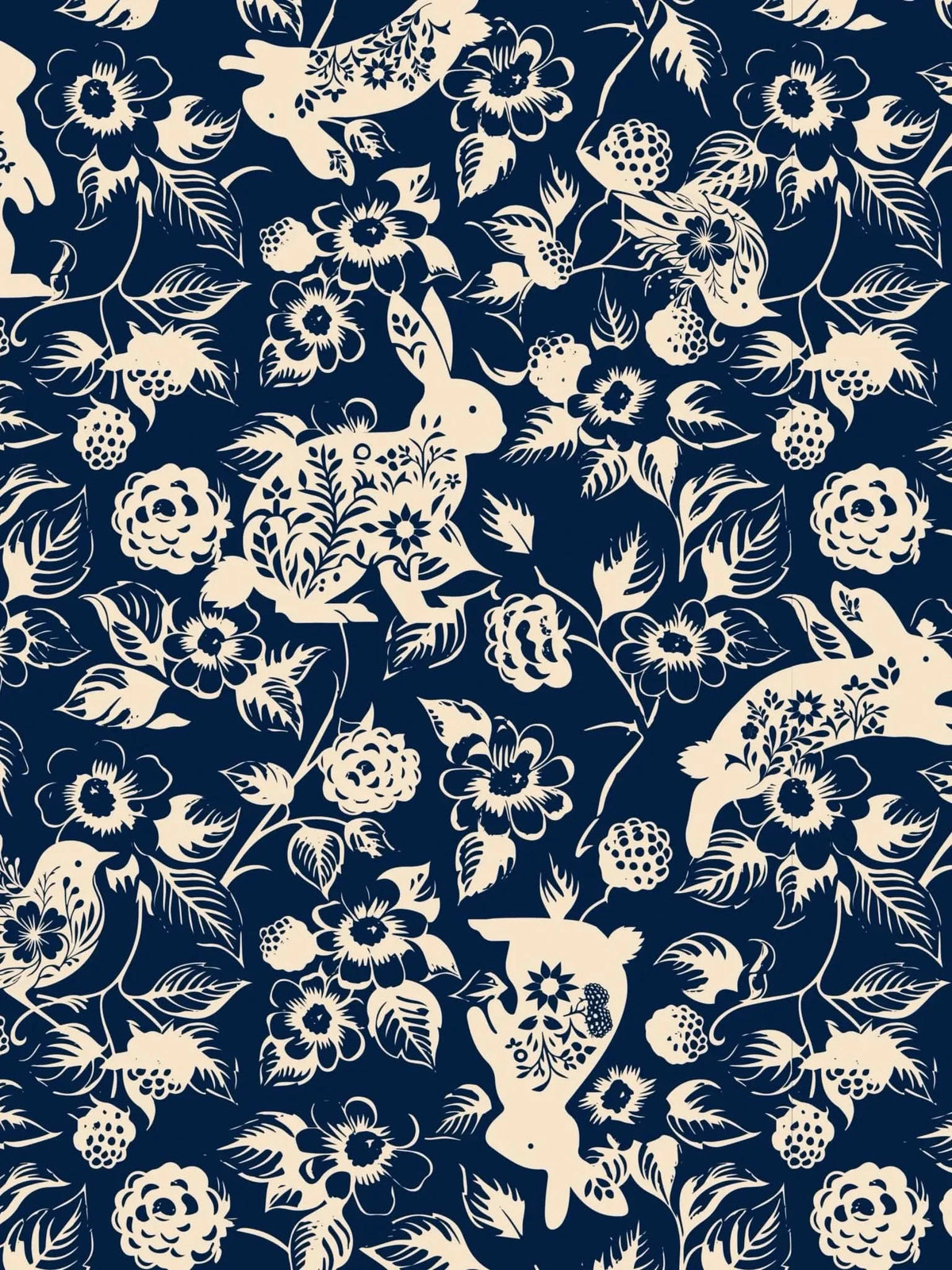 Navy fabric with light-colored bunnies, flowers, and berries.