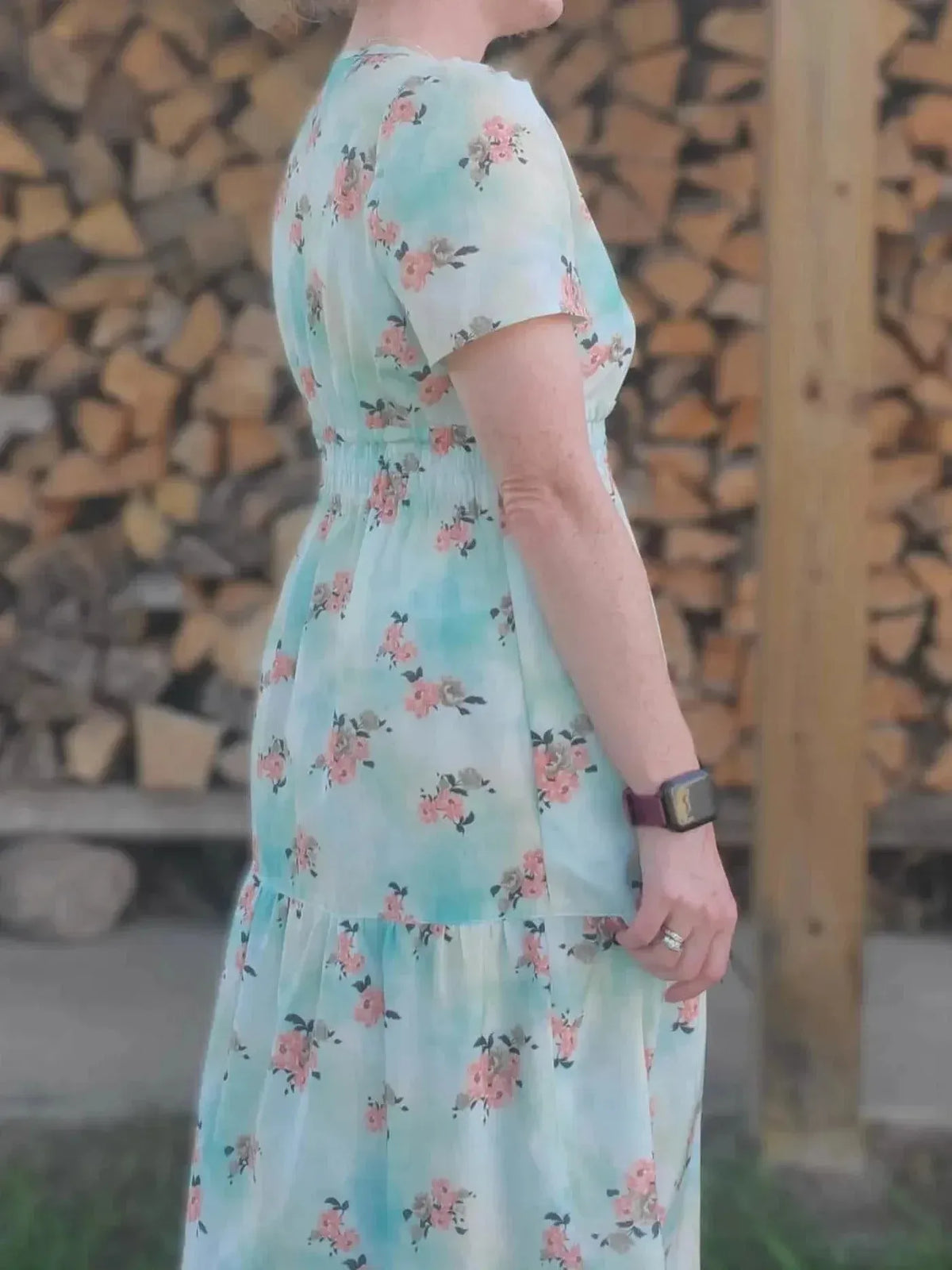 Light blue fabric with floating pink peony floral print.