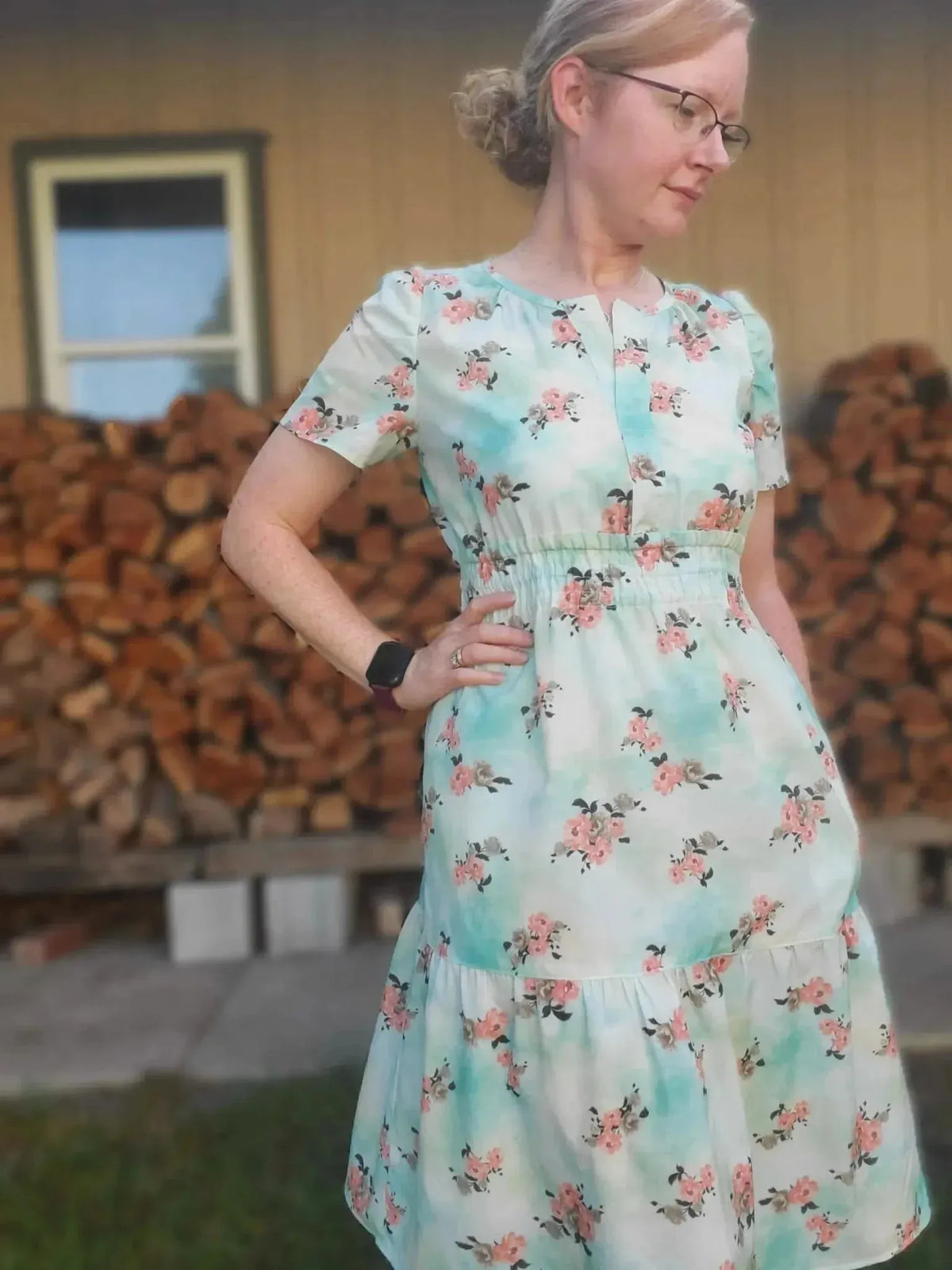 Light blue fabric with floating pink peony floral print.