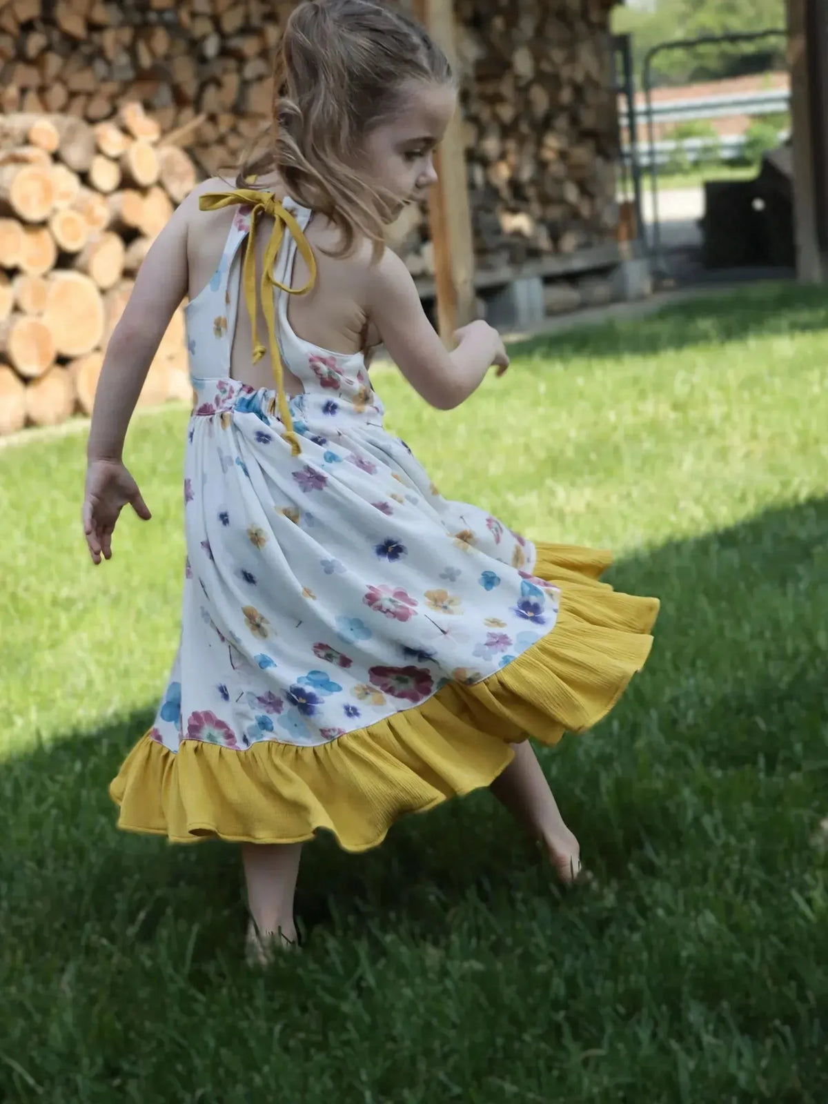 Hand-pressed floral fabric with pastel blooms print in white and yellow tones.