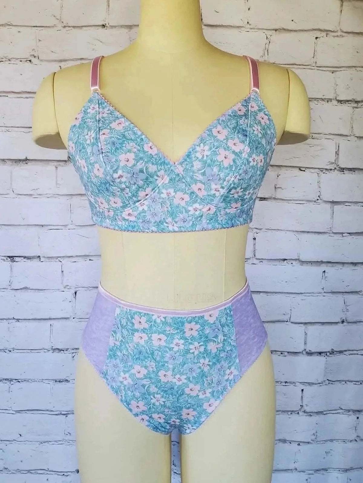 A floral bralette and high-waisted underwear set on a mannequin.