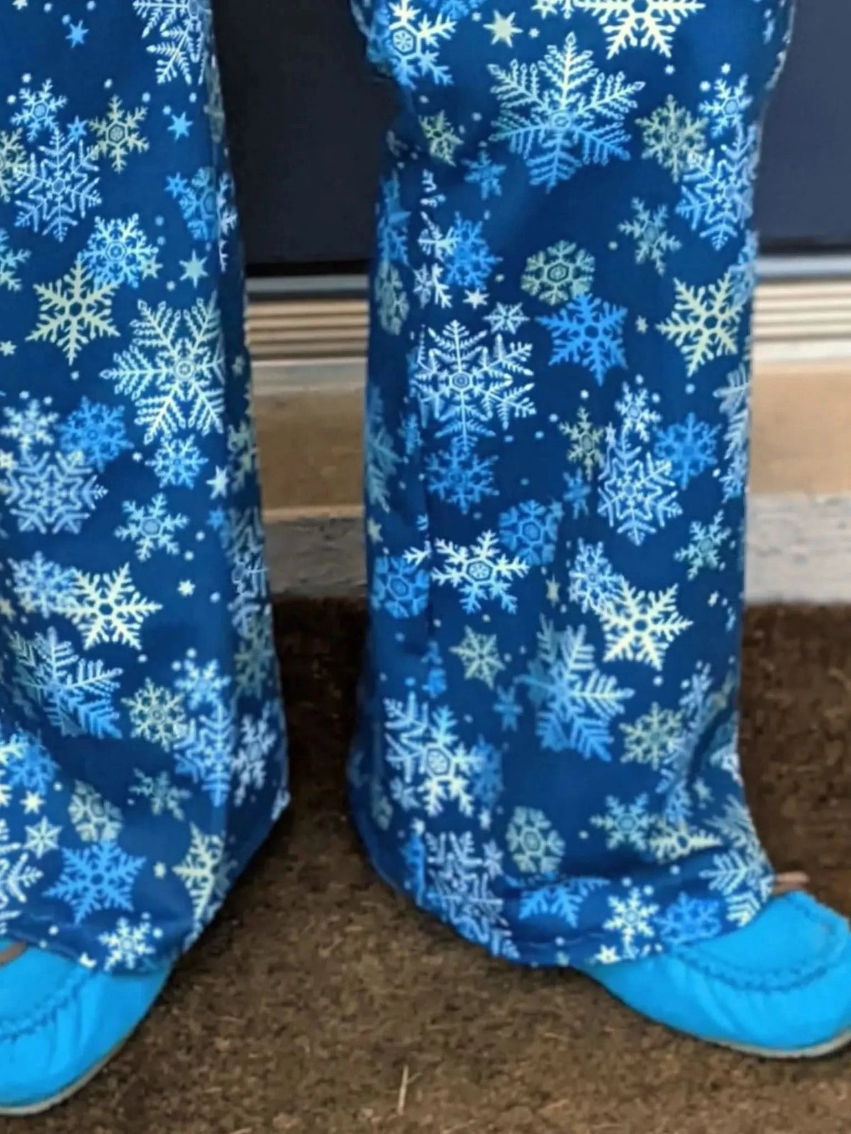 Blue fabric with white and light blue snowflake patterns.