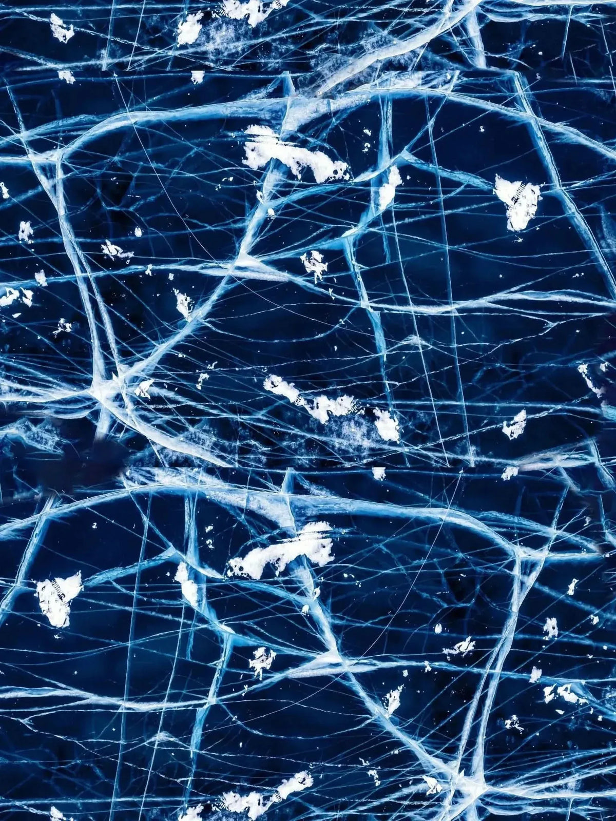 Navy fabric with a cracked ice pattern of white and light blue lines.