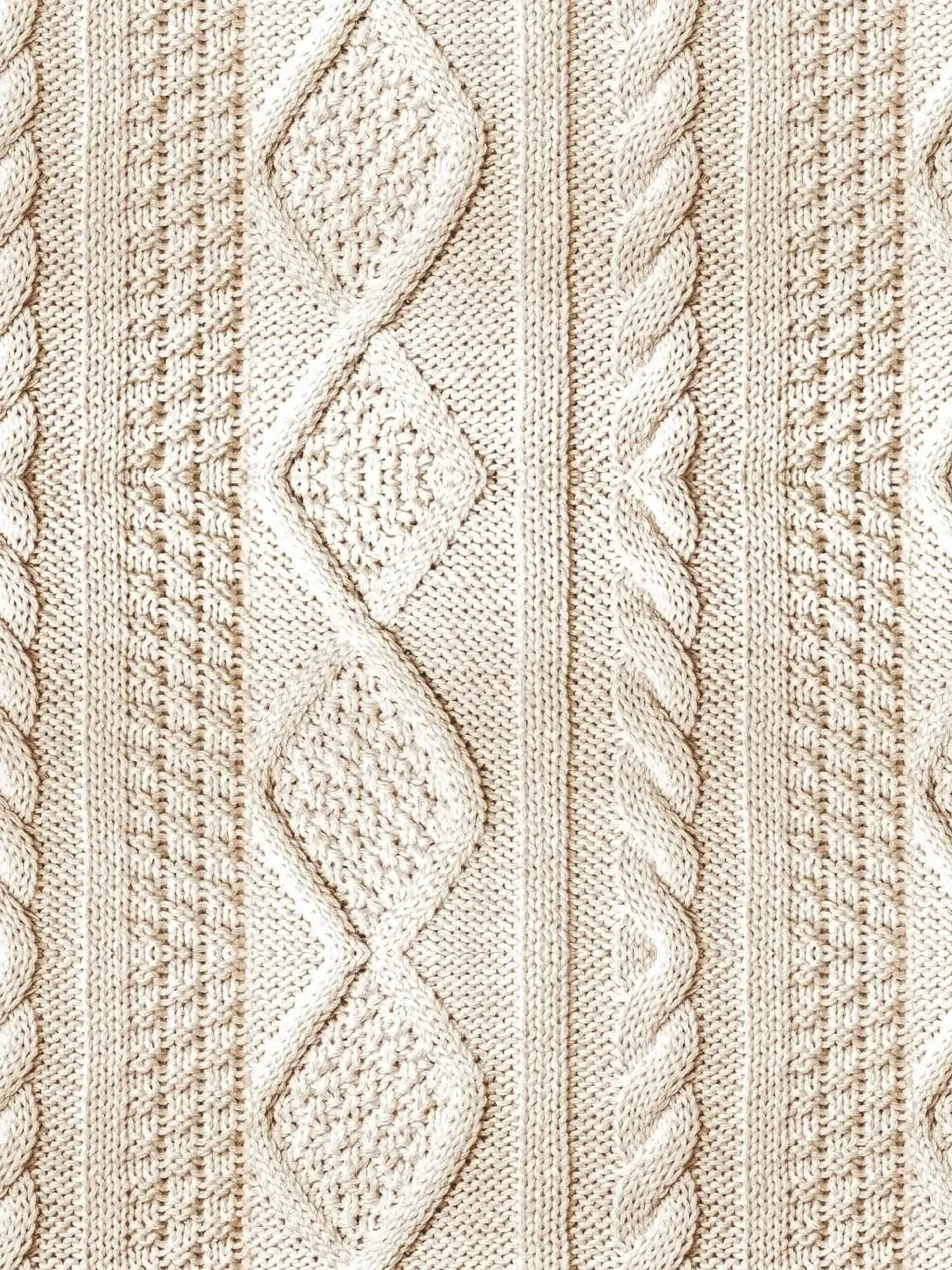 Cream cable knit fabric with various textured patterns.