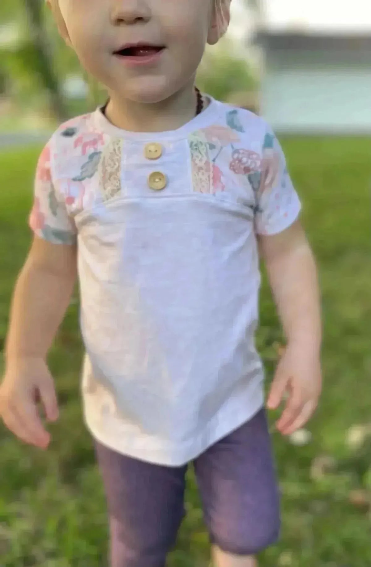 Cream heather fabric with blush floral coordinate print, soft textured weave.