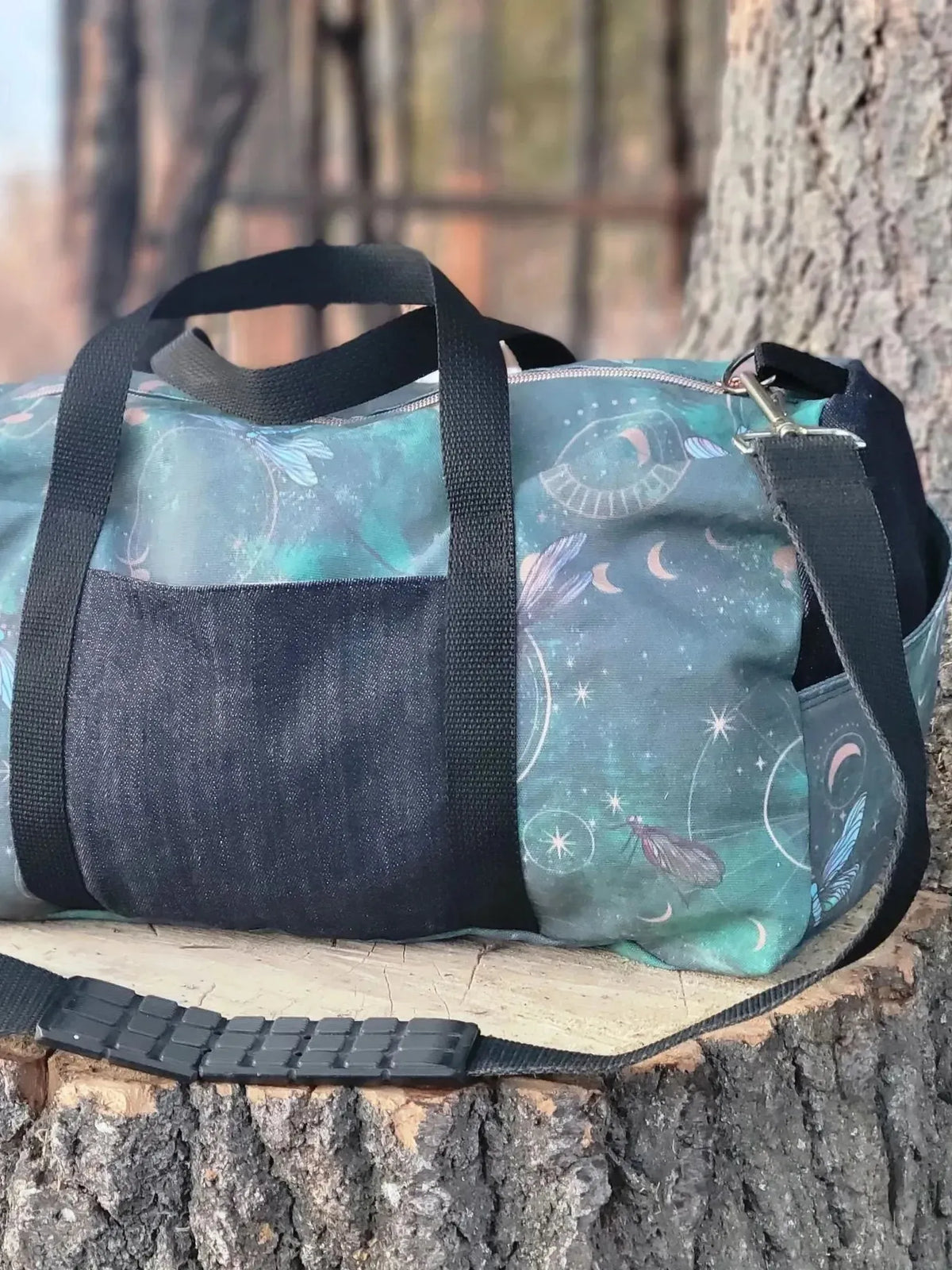 Celestial dragonflies print on green fabric with starry motifs.