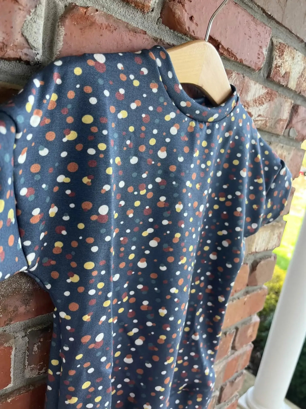 Navy Sprinkles fabric with colorful dots on a dark blue background.