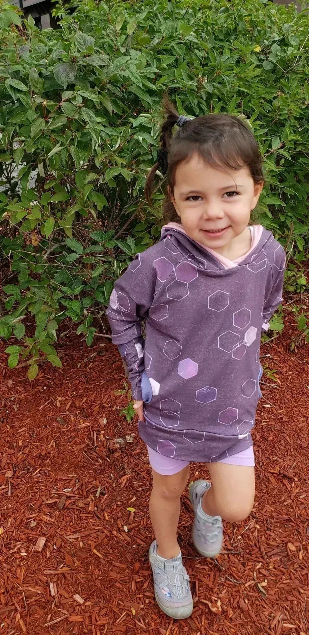 Burgundy geometric hexagon print fabric with a subtle woven texture.