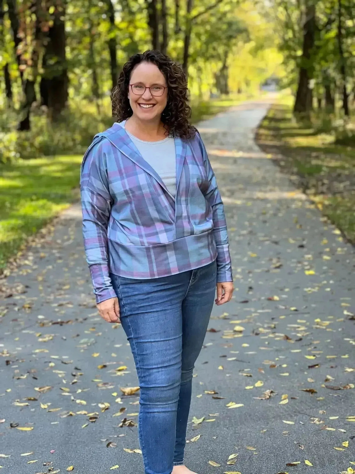 Dark Christmas plaid fabric with festive green and pink holiday print.