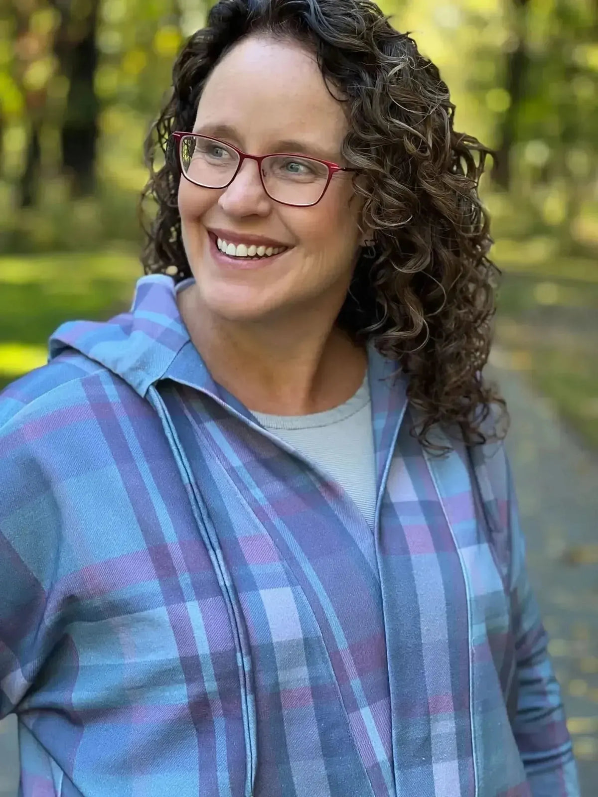 Dark Christmas plaid fabric with festive green and pink holiday print.