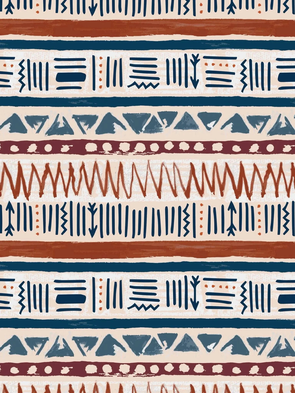 A fabric with a desert-inspired pattern of stripes, triangles, and zigzags.