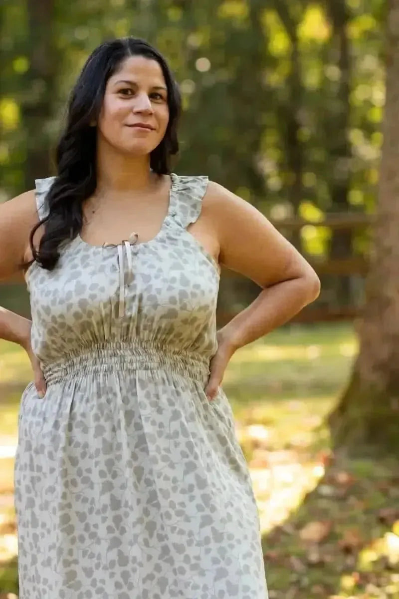 Green leaf print fabric with nature-inspired pattern on light background.