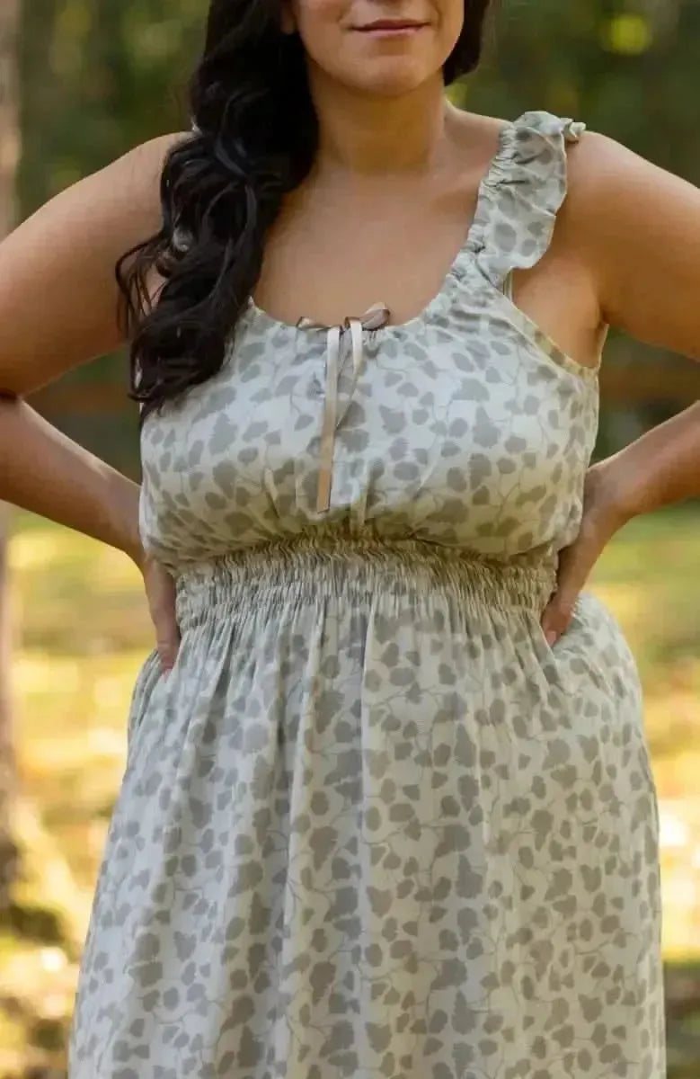 Green leaf print fabric with nature-inspired design in light tones.