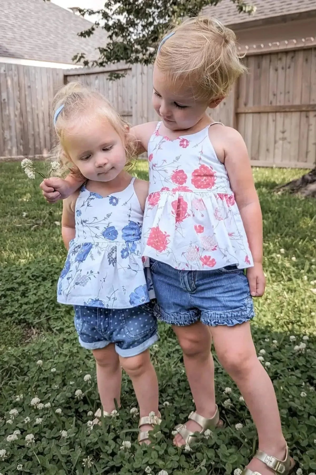 Blue floral print fabric with modern blooms pattern on cotton base.