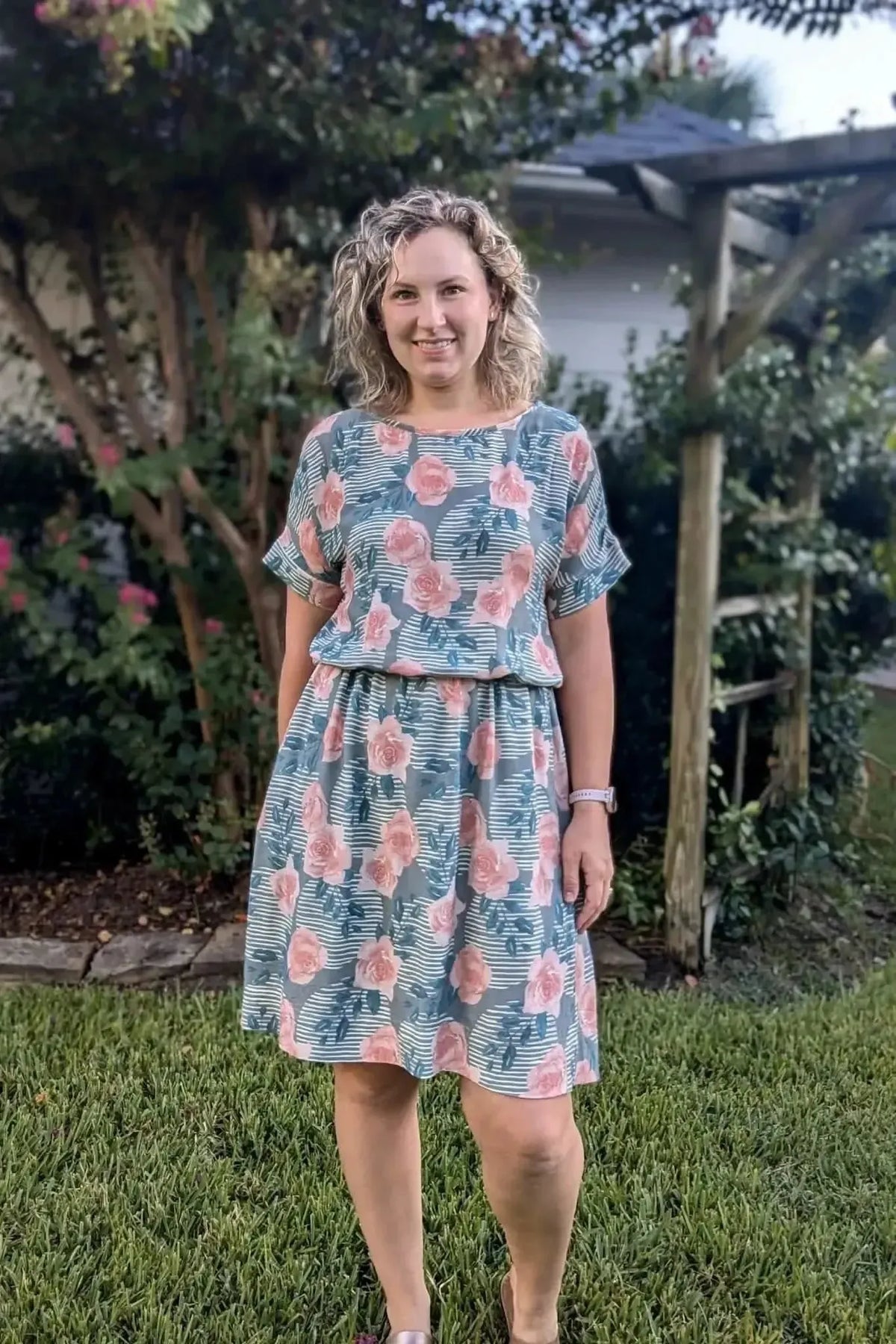 Wild Rose floral print fabric in soft pink and green tones on a light background.